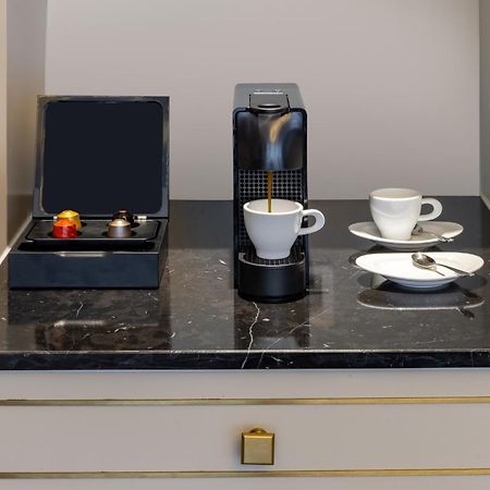 Melia Vinpearl Hue Hotel Bagian luar foto A Nespresso coffee machine in a hotel room