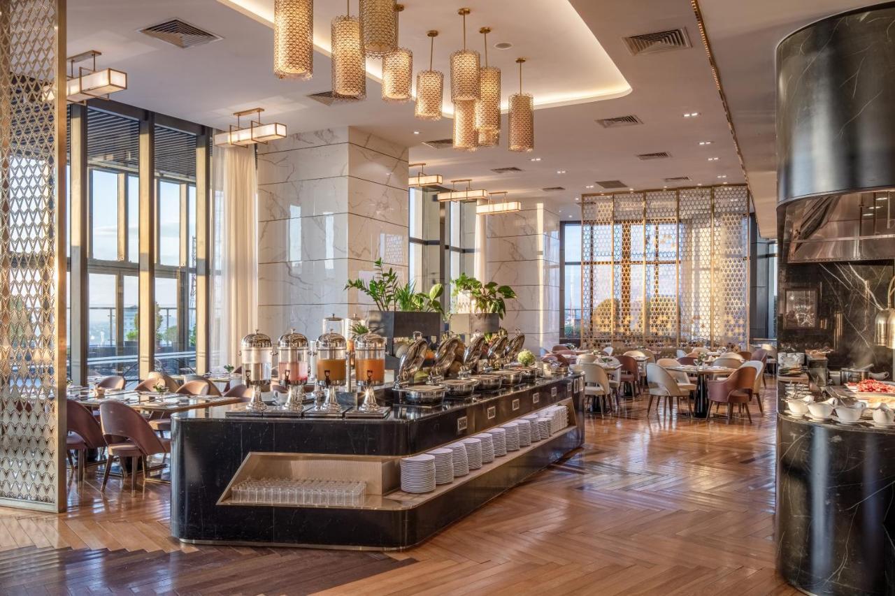 Melia Vinpearl Hue Hotel Bagian luar foto The restaurant