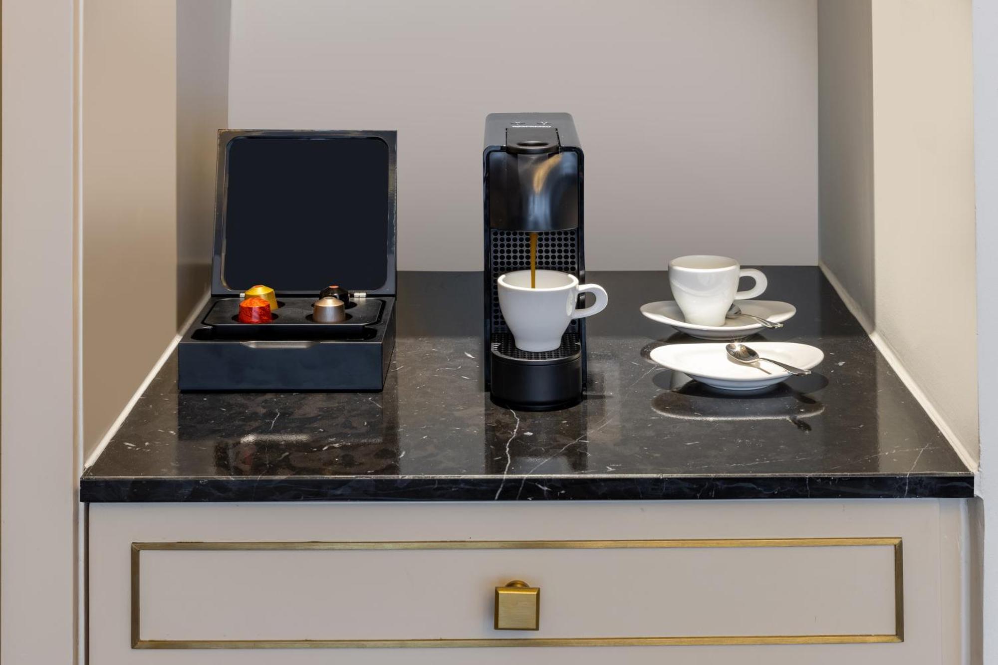 Melia Vinpearl Hue Hotel Bagian luar foto A Nespresso coffee machine in a hotel room